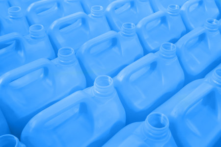 Many empty blue plastic jerrycans background in warehouse, market, factory or exhibitionの写真素材