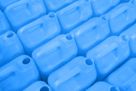 Many empty blue plastic jerrycans background in warehouse, market, factory or exhibitionの写真素材