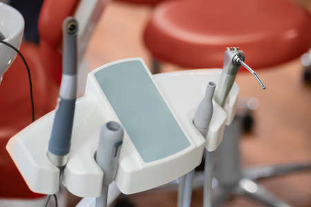 Different tools and dentistry instruments in dental office, surgery. Stomatology, healthcare, workplace and medicine conceptの写真素材