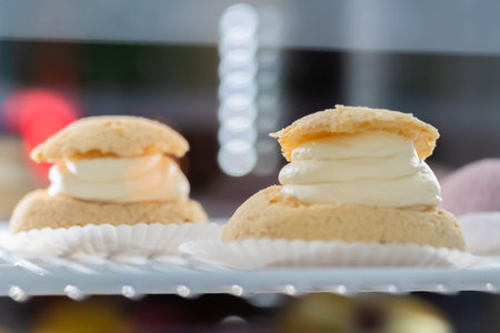 Assortment of delicious fresh cakes with cream on counter for sale at restaurant, cafe, bakery....