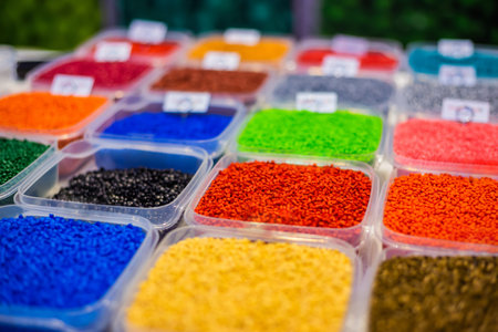 Plastic recycling, renewable resource - heap of colorful secondary polystyrene, polyethylene,...