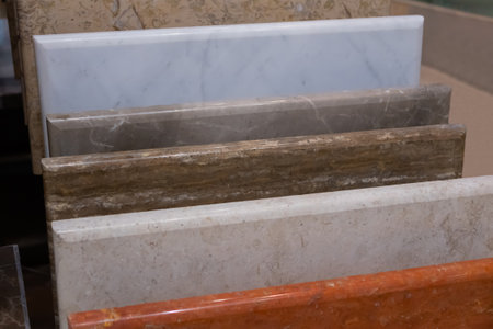 Colorful artificial stone slabs on counter for sale at hardware store, market - close up view. Abstract, retail, design, decoration conceptの写真素材
