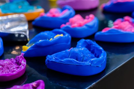 Different colorful dental impressions at medical exhibition. Stomatology, education and medicine...