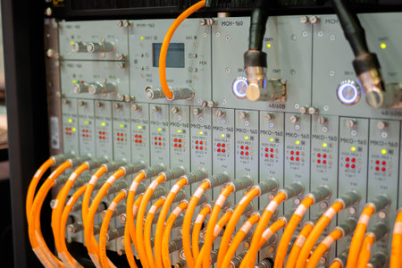MOSCOW, RUSSIA - APRIL 10, 2019: Telecommunications trade show. Telecom technology equipment - fiber optic cables and switch. Network, transfer, traffic, web, hardware, connection and internet conceptのeditorial素材