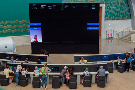 MOSCOW, RUSSIA - JANUARY 5, 2020: Cosmonautics and Aviation Centre. People using interactive touchscreen electronic kiosks in front of large display. Education, technology conceptのeditorial素材