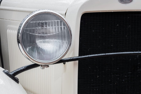 NIZHNY NOVGOROD, RUSSIA - JUNE 15, 2020: Classic Soviet Car Exhibition. Customized beige soviet military ambulance GAZ-55, close up: car headlight. Historical, retro, vintage and nostalgia conceptのeditorial素材