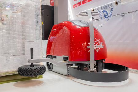 MOSCOW, RUSSIA - JANUARY 5, 2020: Package Exhibition. Automatic red robotic pallet wrapper EMotion during work at trade show, warehouse. Industrial, equipment, technology conceptのeditorial素材