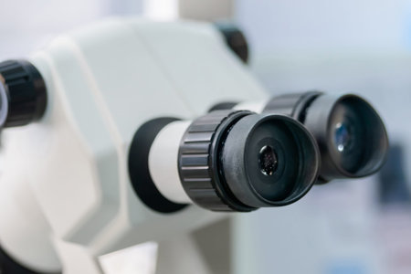 Ocular lens, eyepieces of white optical microscope - close up. Science, biology, optical, laboratory...