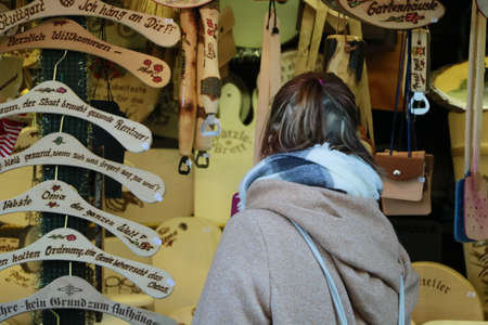 a woman is shopping at the christmas marketの写真素材