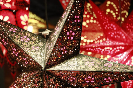 Colorful and illuminated decorative Christmas decorations are displayed in the showcase.の写真素材