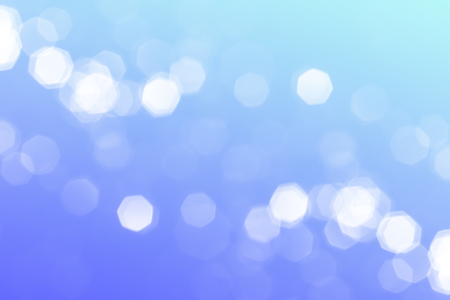 Festive blue gradient background with blurred bokeh lightsの写真素材