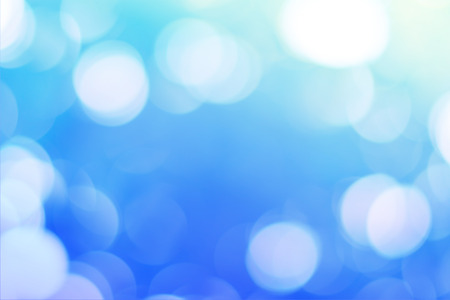 elegant bokeh on blue background and copyspace on central of imageの写真素材
