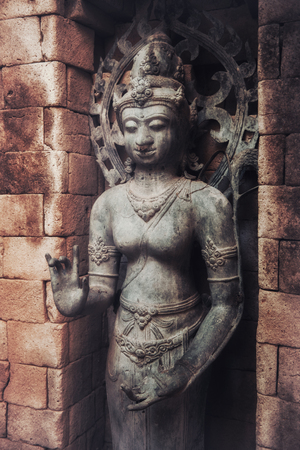 The old stone Buddha statue. Indonesia, Bali.の写真素材