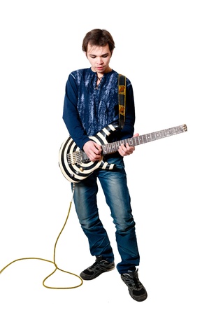 Young guitarist with electric guitar on white backgroundの写真素材