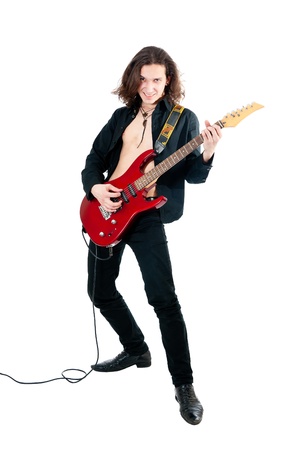 Young guitarist with red guitar on white backgroundの写真素材
