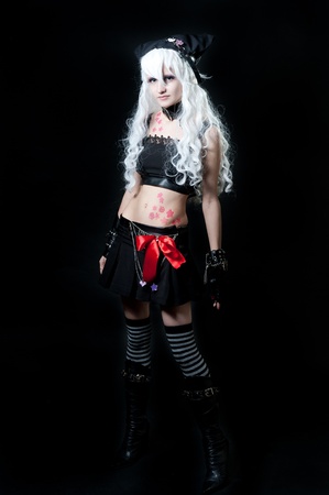 Girl in cosplay suit on black backgroundの写真素材