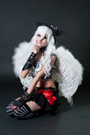 Girl in cosplay suit on black backgroundの写真素材