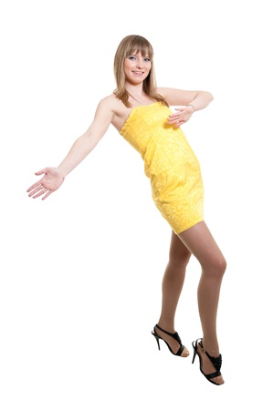Girl in yellow dress isolated on white backgroundの写真素材