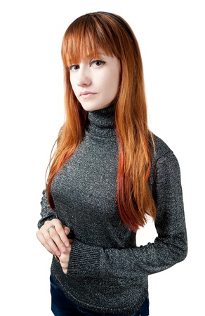 the beautiful girl with red long hair in a sweater isolated on whiteの写真素材