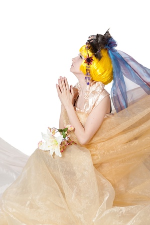 the beautiful girl the princess in a fabric isolated on whiteの写真素材