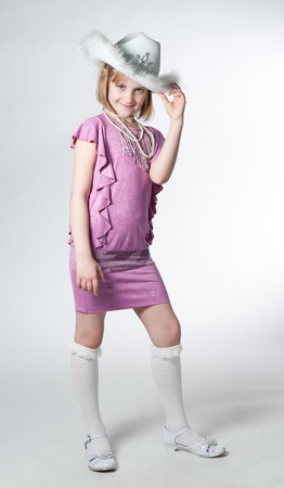 little princess in purple dress isolated on whiteの写真素材