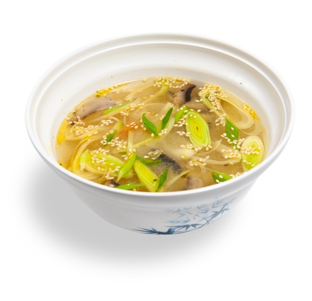 vegetable soup with mushrooms isolated on white backgroundの写真素材