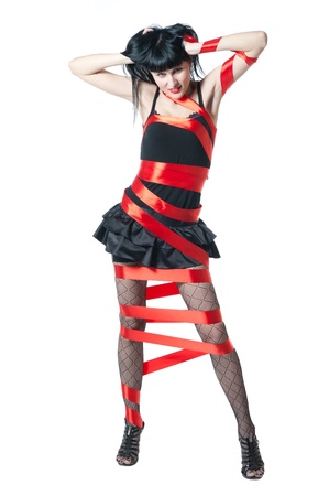 sexy women in black dress rolled up by a red ribbonの写真素材