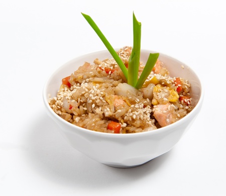 Fried rice with seafood in soy sauce isolated on whiteの写真素材
