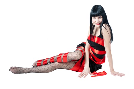 sexy women in black dress rolled up by a red ribbonの写真素材