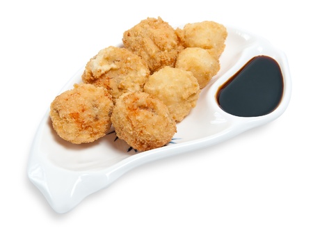 cheese balls with garlic sauce isolated on white backgroundの写真素材