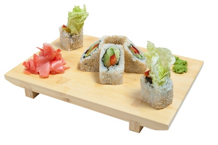 sushi on wooden stand isolated on white backgroundの写真素材