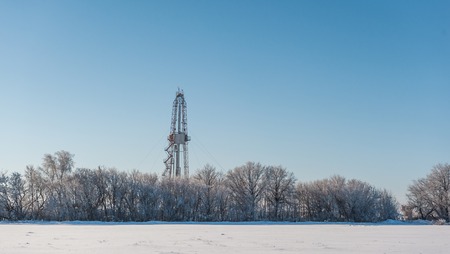 Winter landscape. Drilling rig for the snow-covered forestの写真素材