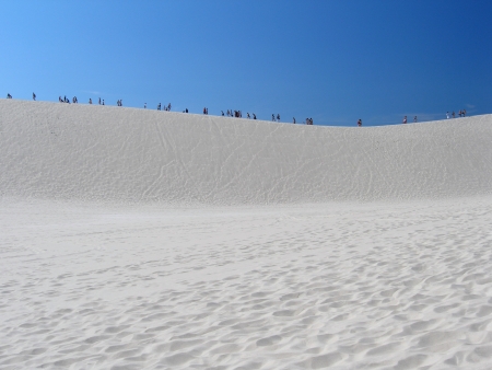 Africa people going on the dune full sunny dayの写真素材