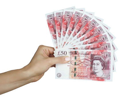UK sterling money pounds in the handの写真素材