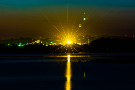 Great radiant sunset over the calm lake