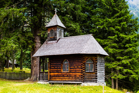 Small wooden church in high mountains Austriaの写真素材
