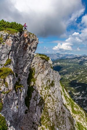 Tourist watching large mountains view Alps Austriaの写真素材