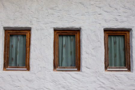 Three old style windows with wooden framesの写真素材