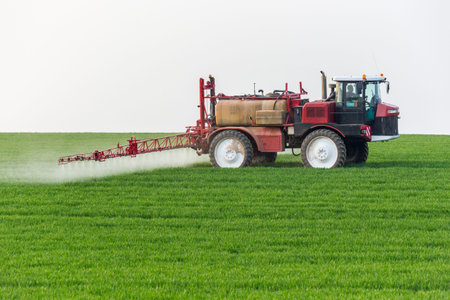 Spraying machine working on the green field