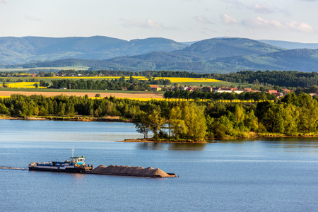 The barge with the sand on the lakeの写真素材