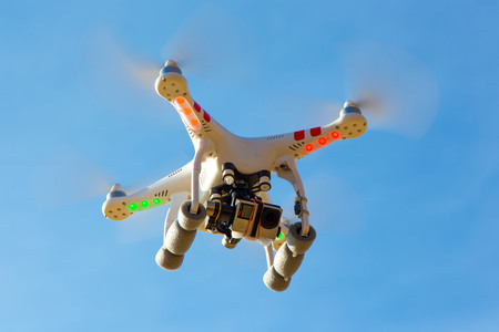 Modern drone flying high in the good weatherの写真素材