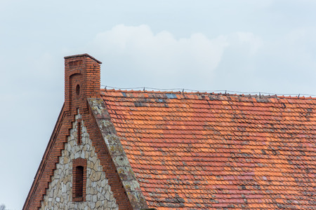 Old rustic roof on the old buildingの写真素材