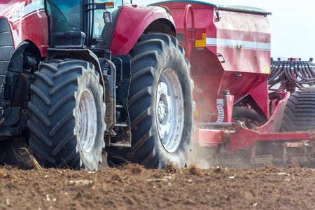 The tractor working on the large field