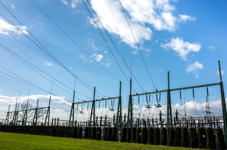 The powerlines on the large green fieldの写真素材