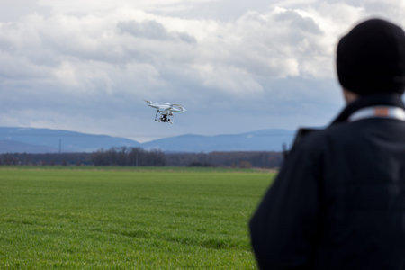 One person controlling the flight of the small drone