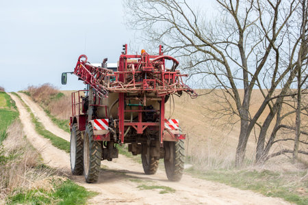 Spraying the herbicides on the green fieldの写真素材