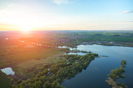 Aerial view on a sunset over the lakeの写真素材