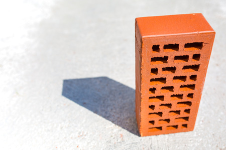 Close view on the single red brickの写真素材