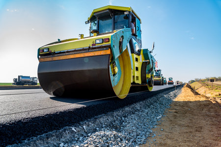 Road rollers building the new asphalt road