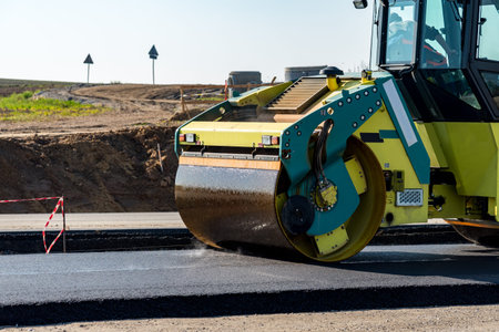 Road rollers building the new asphalt road